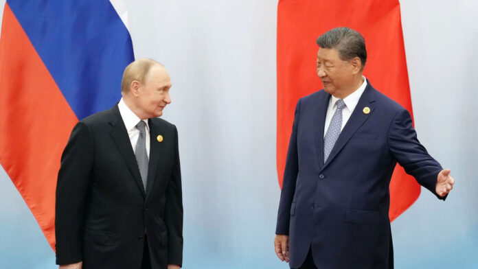El presidente ruso, Vladímir Putin, y el mandatario chino, Xi JinpingKyodo